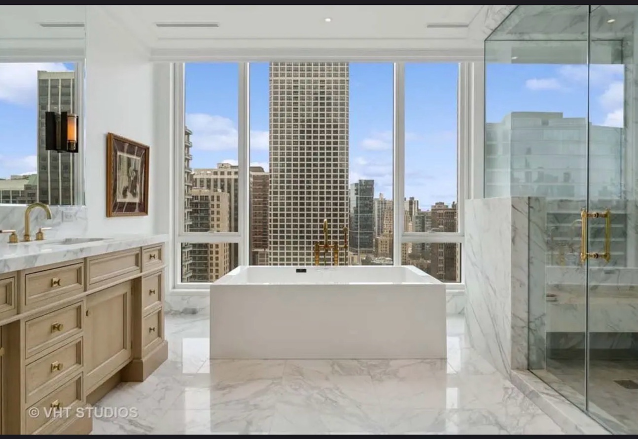 Penthouse bathroom full marble floor walls city view Chicago