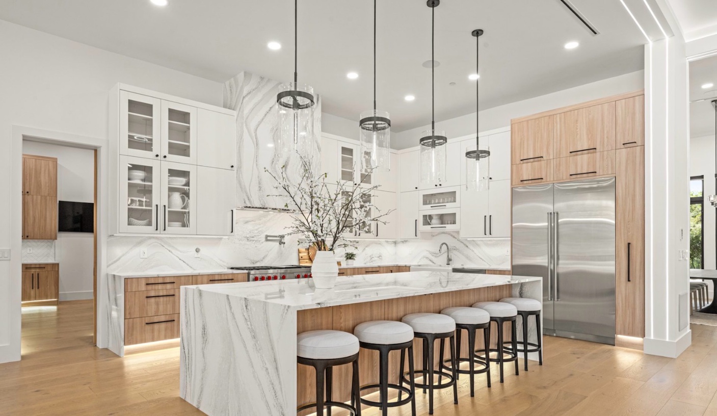 Full marble waterfall island matching backsplash Chicago