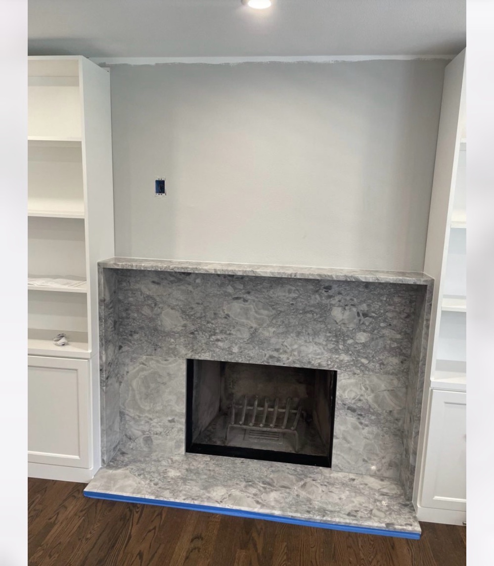 Grey marble fireplace surround freshly installed Chicago