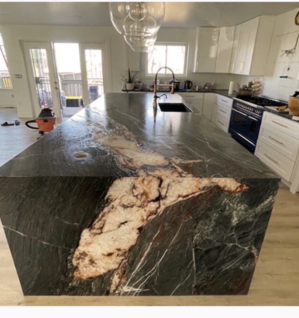 Dark exotic stone waterfall island kitchen Chicago