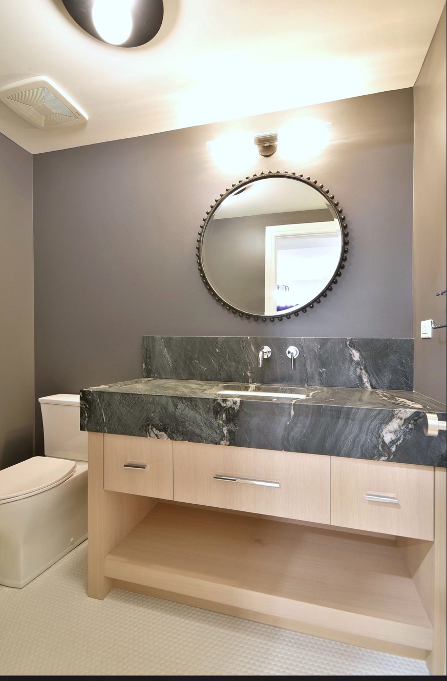 Dark leathered stone bathroom vanity with backsplash Chicago